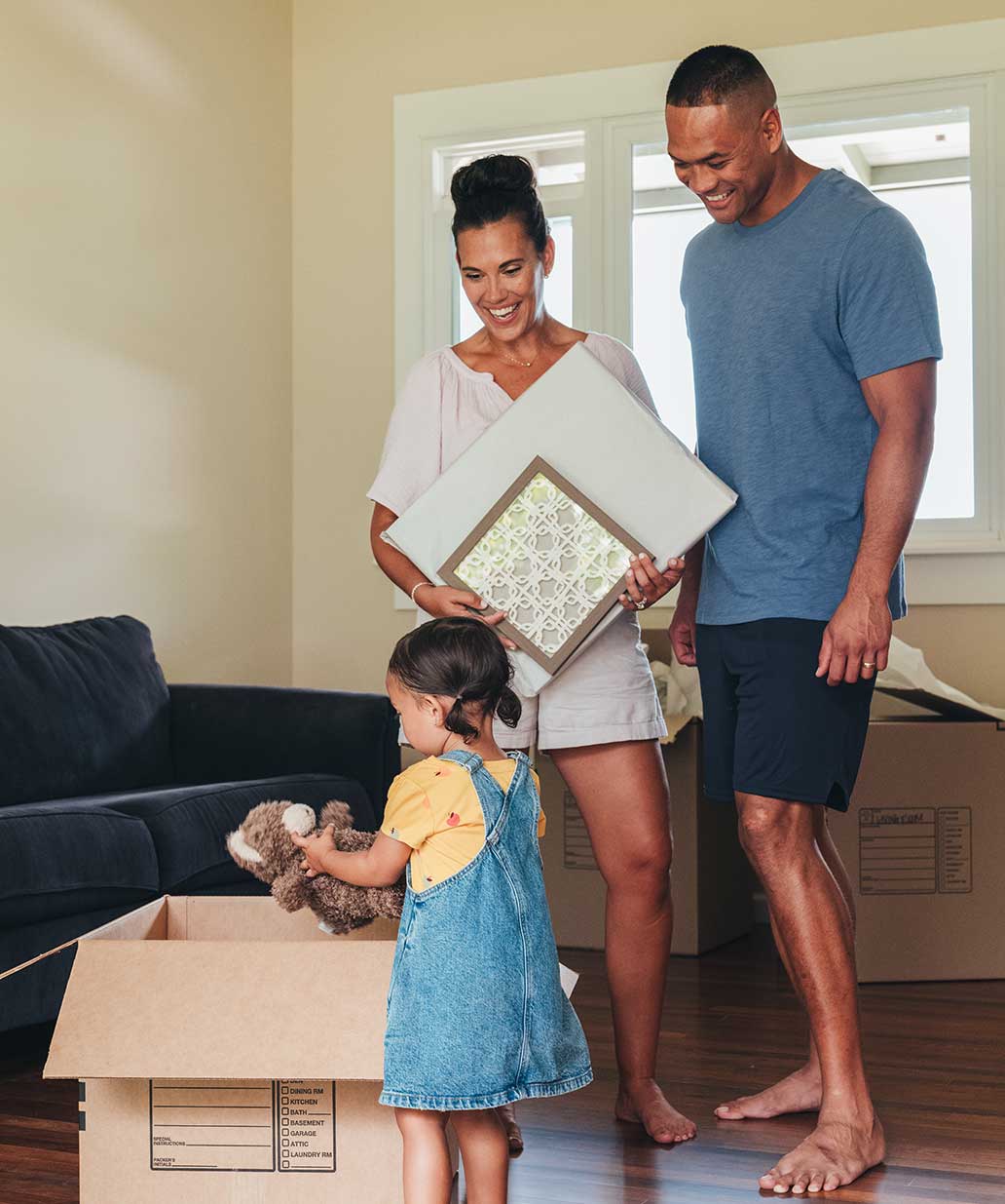 Family unpacking boxes